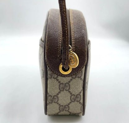 70s / 80s Era Vintage Gucci Monogram Canvas Oval Crossbody Bag – Brown GG Supreme with Leather Trim and Gold-Tone Hardware